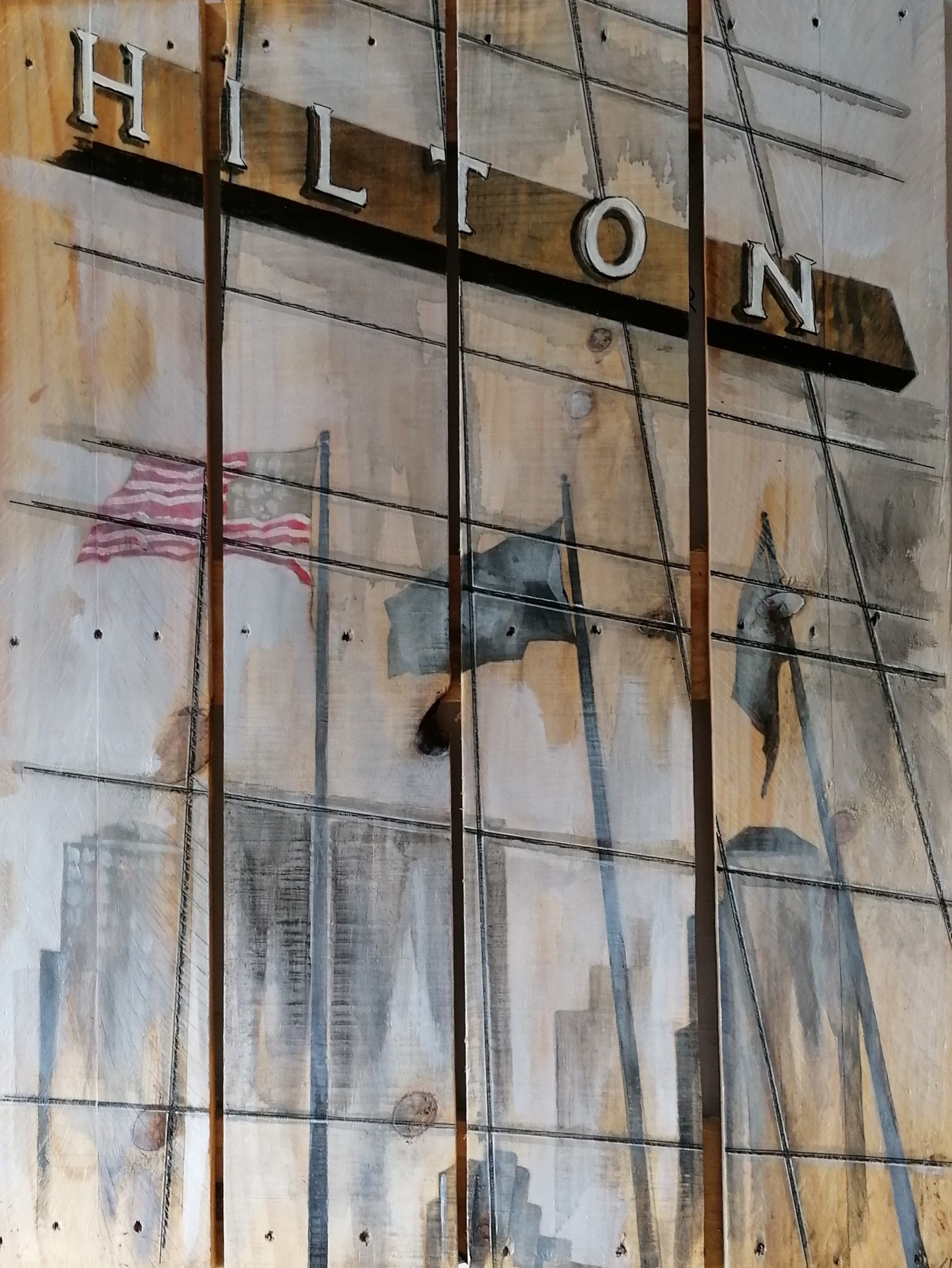 Peinture des drapeaux de la façade du Hilton